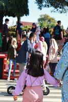 Kudus, January 2023. A snapshot of the crowds of car free day visitors crossing the zebra crossing to get to alun alun simpang 7 kudus. photo