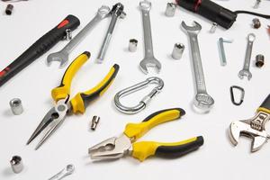 Set of tools for repair in a case on a white background. Assorted work or construction tools. Wrenches, Pliers, screwdriver. Top view photo