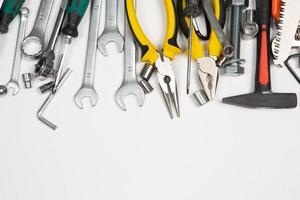 Set of tools for repair in a case on a white background. Assorted work or construction tools. Wrenches, Pliers, screwdriver. Top view photo