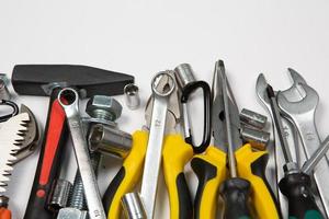 Set of tools for repair in a case on a white background. Assorted work or construction tools. Wrenches, Pliers, screwdriver. Top view photo