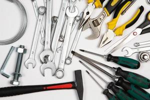 Set of tools for repair in a case on a white background. Assorted work or construction tools. Wrenches, Pliers, screwdriver. Top view photo