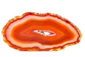 Macro mineral orange agate in crystals on white background photo