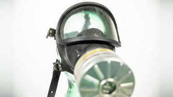 spinning gas mask agaisnt white video