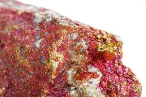 Macro mineral stone Chalcopyrite in the rock on a white background photo