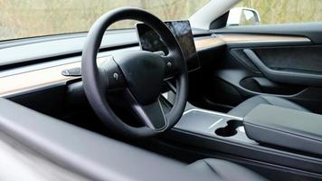 Interior dashboard with a modern interface design and steering wheel. photo