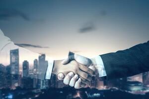 Double exposure of Business agreement handshake hand gesture with night view city building landscape background. photo