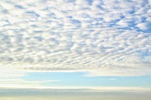 White light soft clouds floating in blue sky. Nature morning landscape background. Clear spring wind. Bright summer day. Winter calm air skyscape. Abstract panorama. Change climate. Low angle view photo