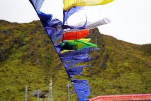 Worship or Pray flag blowing with Wind in Tsomgo or Changu Lake at Sikkim photo