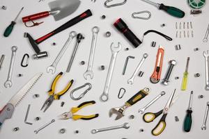 Set of tools for repair in a case on a white background. Assorted work or construction tools. Wrenches, Pliers, screwdriver. Top view photo