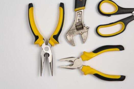 Set of tools for repair in a case on a white background. Assorted work or construction tools. Wrenches, Pliers, screwdriver. Top view photo