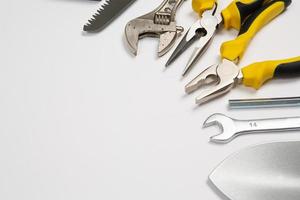 Set of tools for repair in a case on a white background. Assorted work or construction tools. Wrenches, Pliers, screwdriver. Top view photo