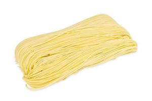 Chinese dry egg noodles isolated on white background photo