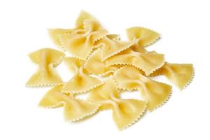 group of raw farfalle pasta isolated on white background. pile of farfalle pasta isolated on white background photo