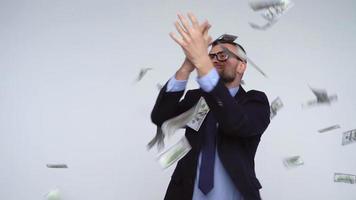 Slow motion of dollars falling on formally dressed man video