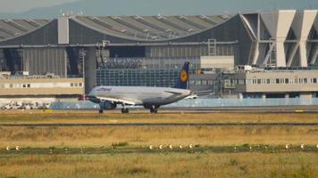 FRANKFURT AM MAIN, GERMANY JULY 20, 2017 - Long shot, Lufthansa Airbus A321 braking after landing at Frankfurt airport FRA. Tourism and travel concept. Airplane on the runway video