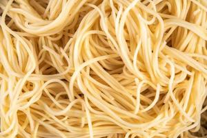 Texture of instant noodles. Texture of egg noodles. Texture of yellow noodles photo