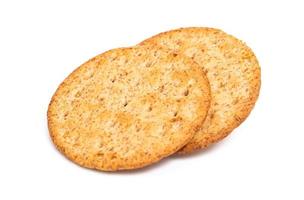 Baked round cracker chips isolated on white background. Wheat cracker chips isolated on white background. Whole wheat cracker isolated on white background with clipping path photo