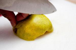 Slicing a pear close up photo