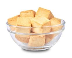 close-up of a pile of diced fish tofu in glasses bowl isolated white background with clipping path photo