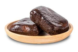 caramel tofu in wooden dish isolated on white background. dry tofu in wooden dish isolated on white background. five spice tofu isolated on white background with clipping path photo