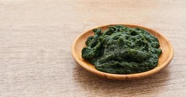 heap of Fresh Korean Seaweed Fulvescens or Maesaengi in wood plate on wooden table background. Seaweed Fulvescens photo