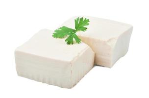 white tofu and green leaves isolated on white background with clipping path photo