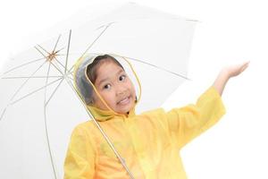 Happy girl is wearing yellow raincoat photo