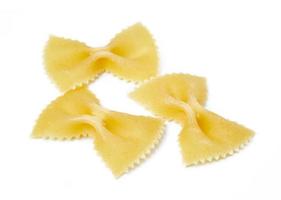 group of raw farfalle pasta isolated on white background. pile of farfalle pasta isolated on white background photo
