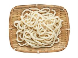 top view or flat lay udon noodle in wood bowl isolated on white background with clipping path photo