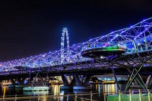 SINGAPORE - 29 October-the Helix bridge on October 29, 2014 in Singapore. The Helix bridge with Singapore Flyer in background, Singapore photo