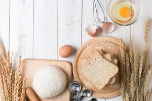 Bread wheat on old white wood background, concept healthy food and copy space photo