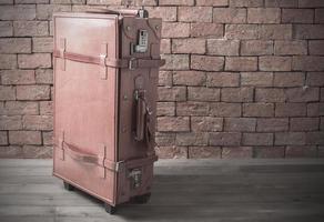 leather retro baggage on brick background photo