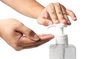 a man washing hands with alcohol gel or antibacterial soap sanitizer to prevent corona virus isolated on white background with clipping path. photo