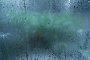 Window with condensate or steam after heavy rain, large texture or background photo