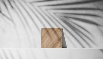 3D white podium and wood stage for packaging or cosmetic with palm shadow. mock-up stand product scene background. 3d podium stage rendering minimal style white color photo