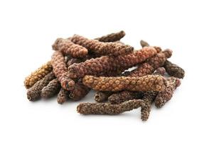 long pepper or piper longum isolated on white background. heap of long pepper or piper longum isolated. long pepper, piper longum photo