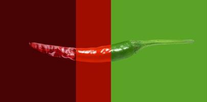 Fresh Green Chili Red Chili Dried Chili Isolated On Red Green Background photo