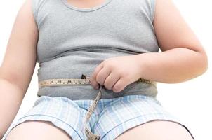 obeso grasa chico medición su barriga con medición cinta foto