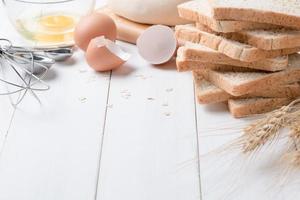 slice bread with ingredients for making bread photo