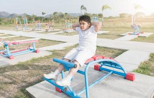 obese fat boy exercise at public Health Park photo