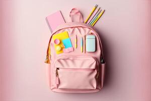 pink School backpack with different colorful stationer. photo
