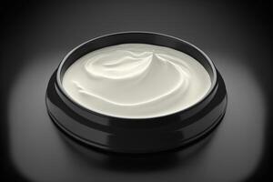 Skin Care Cream isolated on black plate. photo