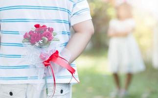 Bouquet Roses in hand man for little bride photo