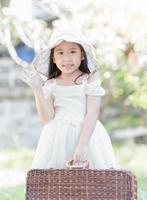 cute asian girl hold wicker bag photo