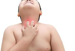 Obese fat boy scratch the itch with hand, throat irritation photo