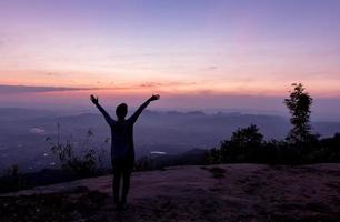 Freedom and happiness woman at Pha Nok Aen Cliff photo