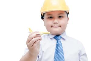 airplane in hand young engineer pilot isolated on white background photo