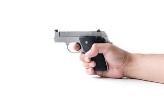 pequeño automático pistola en mano hombre aislado foto