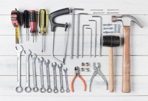 set of tools supplies on wood background photo