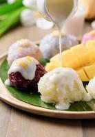 coconut milk on sticky rice with ripe mango photo